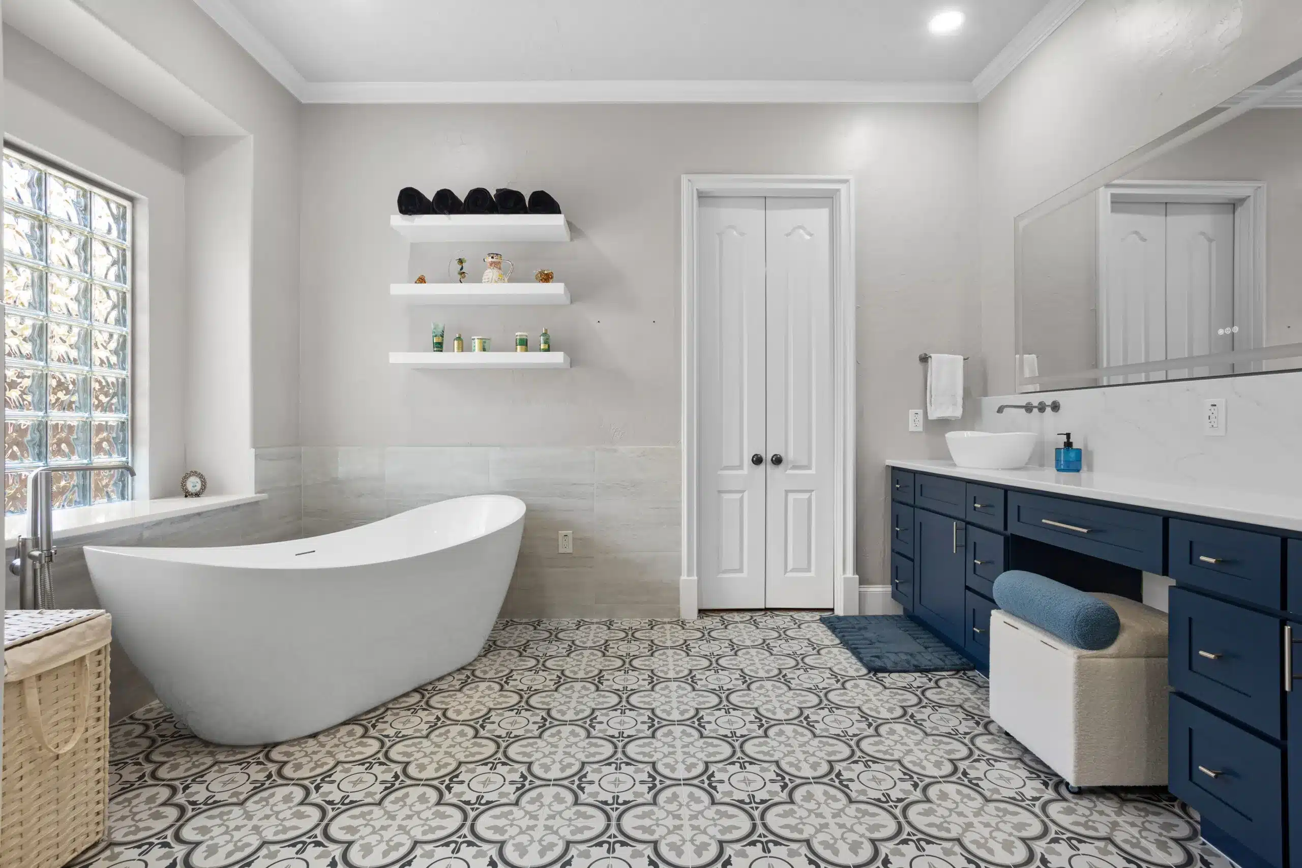 Kitchen and Bathroom Remodeling in Euless highlighting a contemporary bathroom remodel with elegant tile work and modern fixtures