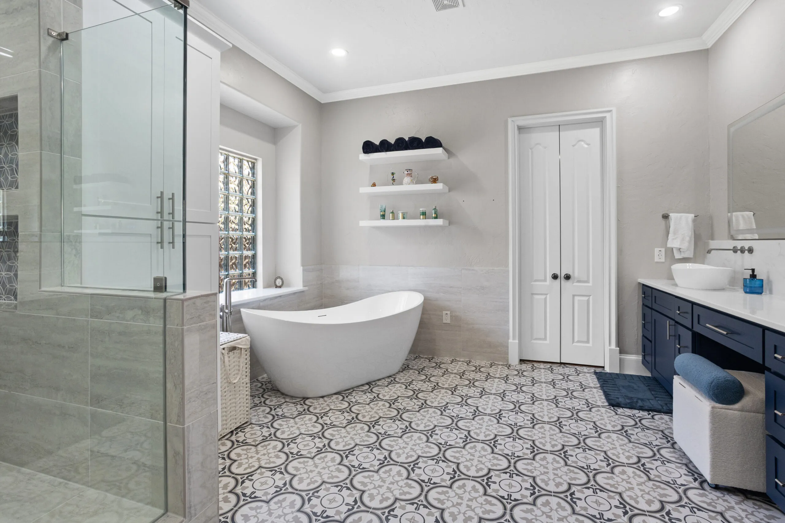 High-quality Kitchen and Bathroom Remodeling in Bedford highlighting a luxury bathroom with a walk-in shower, custom vanity, and elegant tilework