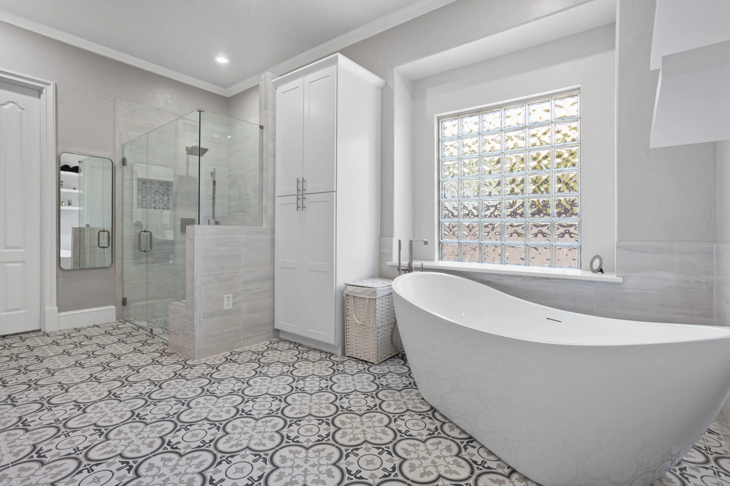 Reliable Kitchen and Bathroom Remodeling in Bedford featuring a contemporary bathroom with a double vanity, modern fixtures, and stylish storage solutions