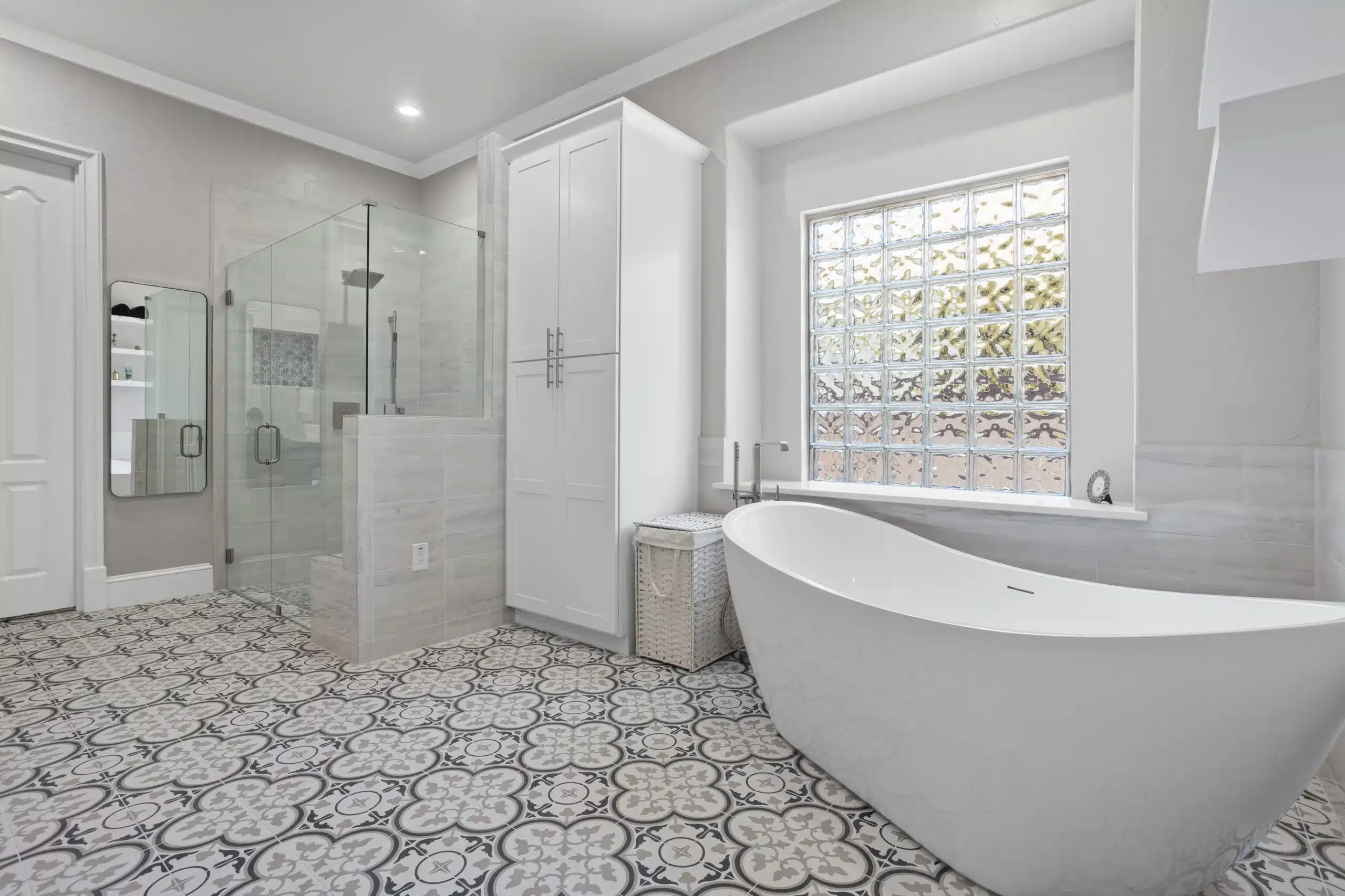 Contemporary bathroom remodel completed as part of Kitchen and Bathroom Remodeling in North Richland Hills with upgraded fixtures and functional storage