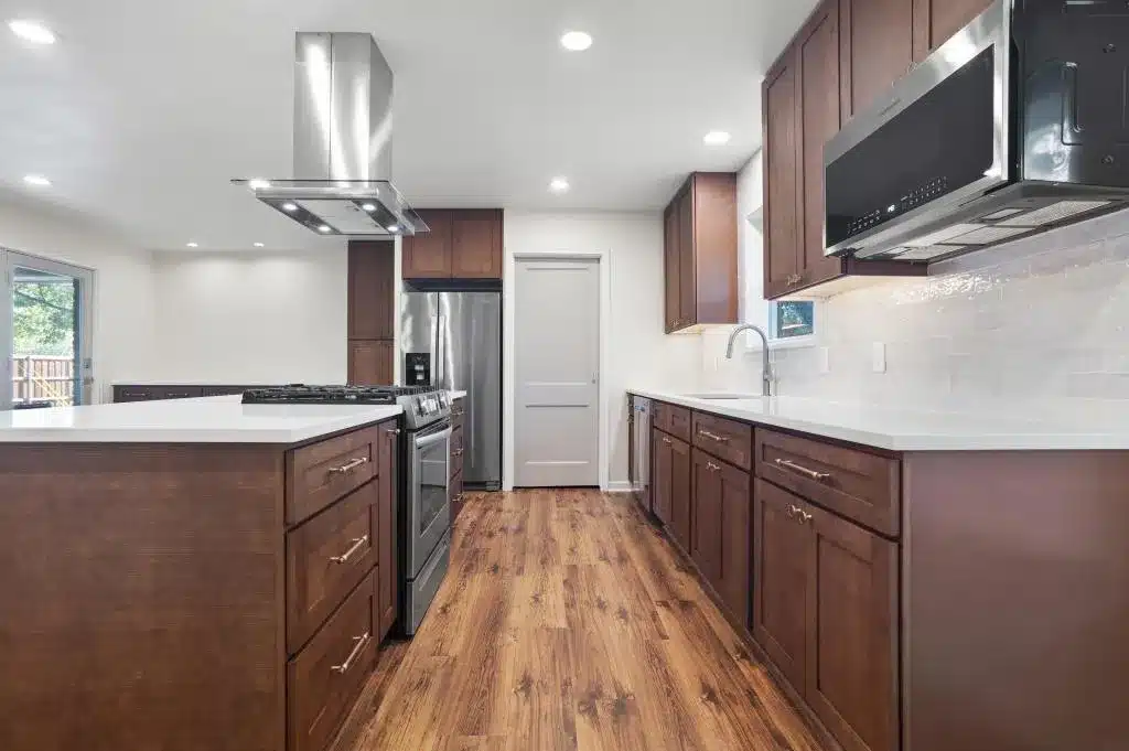 Kitchen and Bathroom Remodeling in Euless featuring a modern kitchen with custom cabinetry, quartz countertops, and upgraded lighting