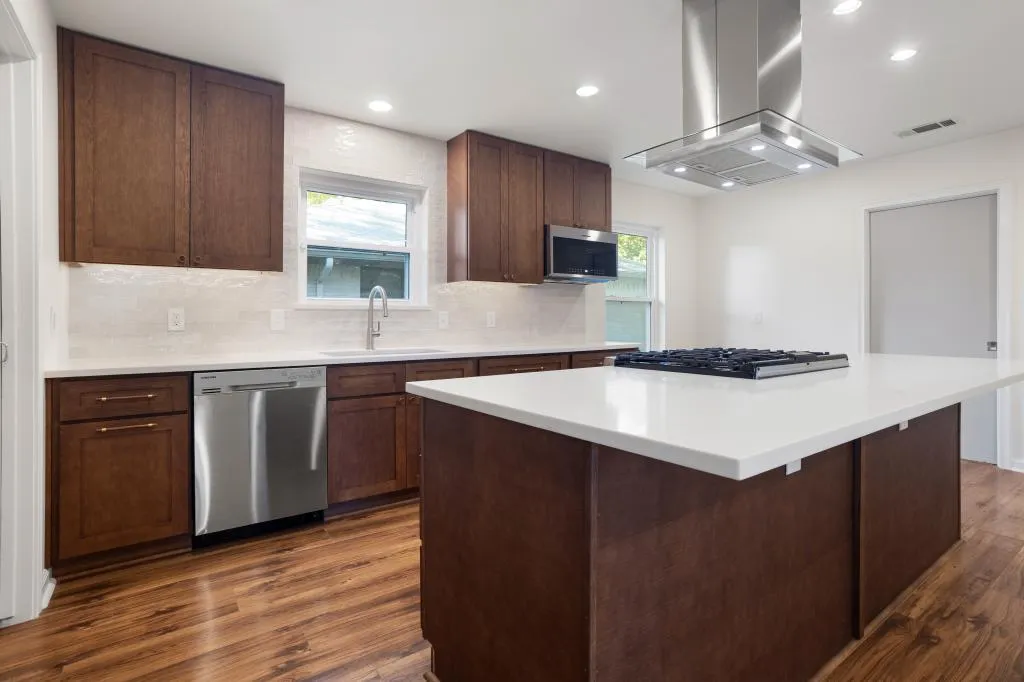 Expert Kitchen and Bathroom Remodeling in Bedford featuring a custom kitchen with modern cabinetry, quartz countertops, and a spacious layout