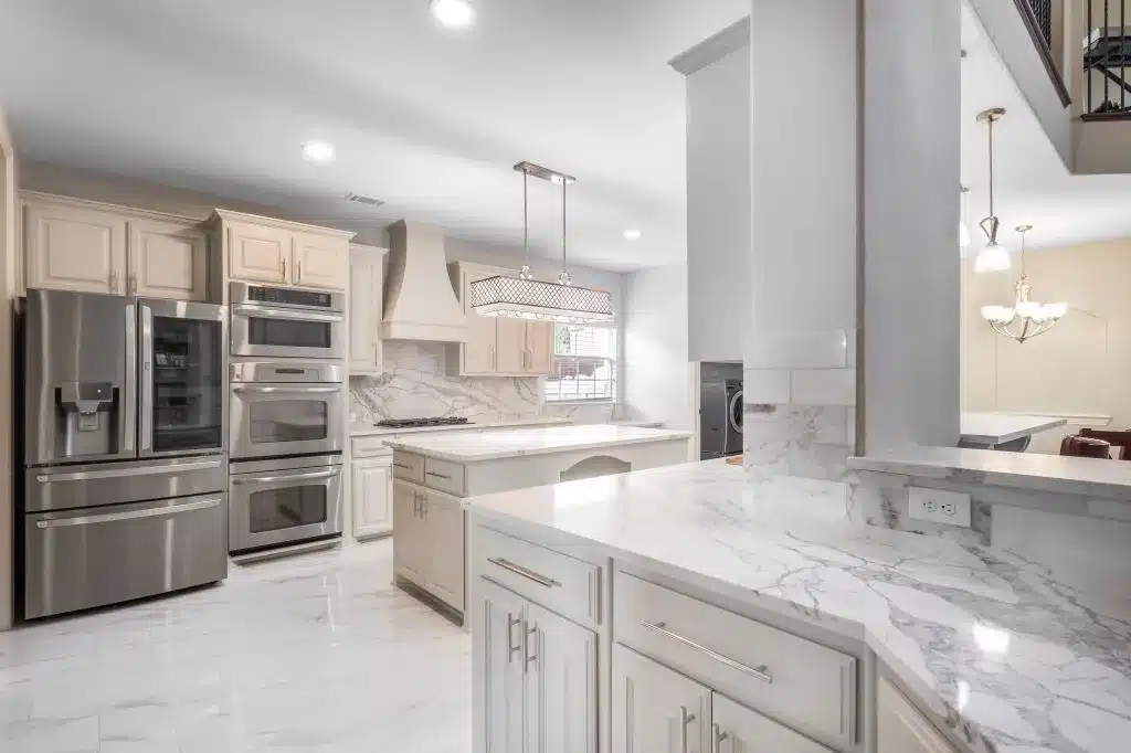 Open-concept kitchen transformation completed through Kitchen and Bathroom Remodeling in Haltom City with updated countertops and lighting