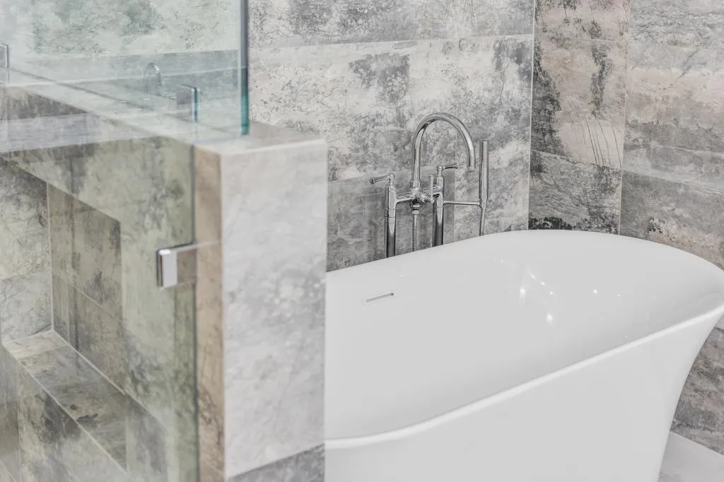 Bathroom Remodeling Colleyville contemporary bathroom with patterned tile flooring and clean design
