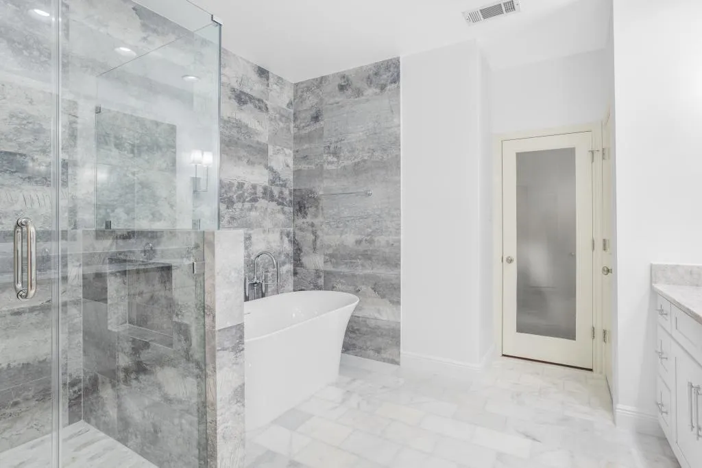 Bathroom Remodeling Colleyville luxury double vanity with marble countertop and lighting